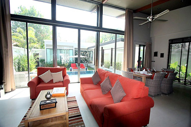 Living and Dining Area with Garden and Pool View